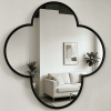 Black quatrefoil wall mirror with four rounded lobes and a deep metal frame Black Quatrefoil Wall Mirror