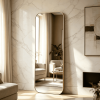 Gold rounded corner full length mirror leaning against a marble wall in a modern living room Rounded Corner Full Length Mirror