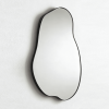 Vertical freeform mirror defined by a recessed lower curve Organic Freeform Metal Wall Mirror